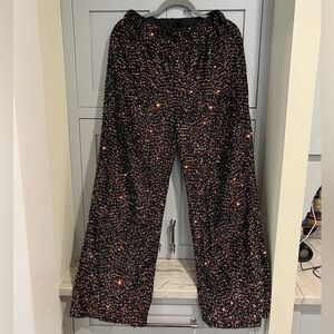 Women’s elastic waist sequin pants. Black with rose gold sequins. Lined. L 8/10.